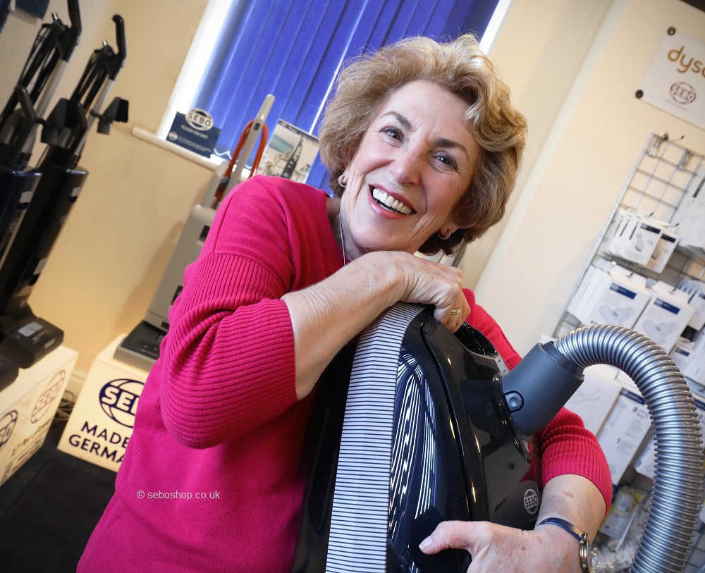 Edwina Currie with a Sebo vacuum cleaner