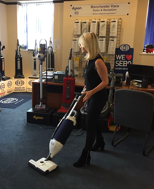 Holly Harwood vacuuming
